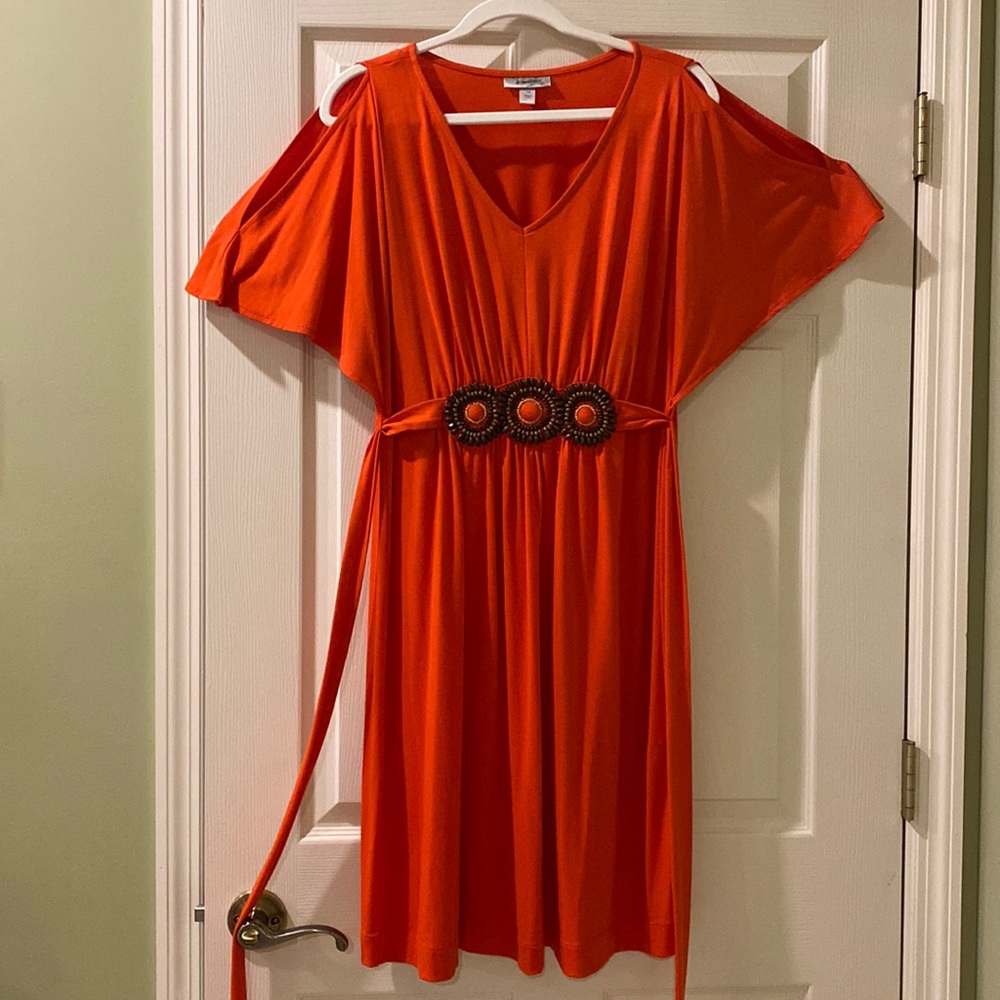 Dress, coral/orange in color, cut out sleeves